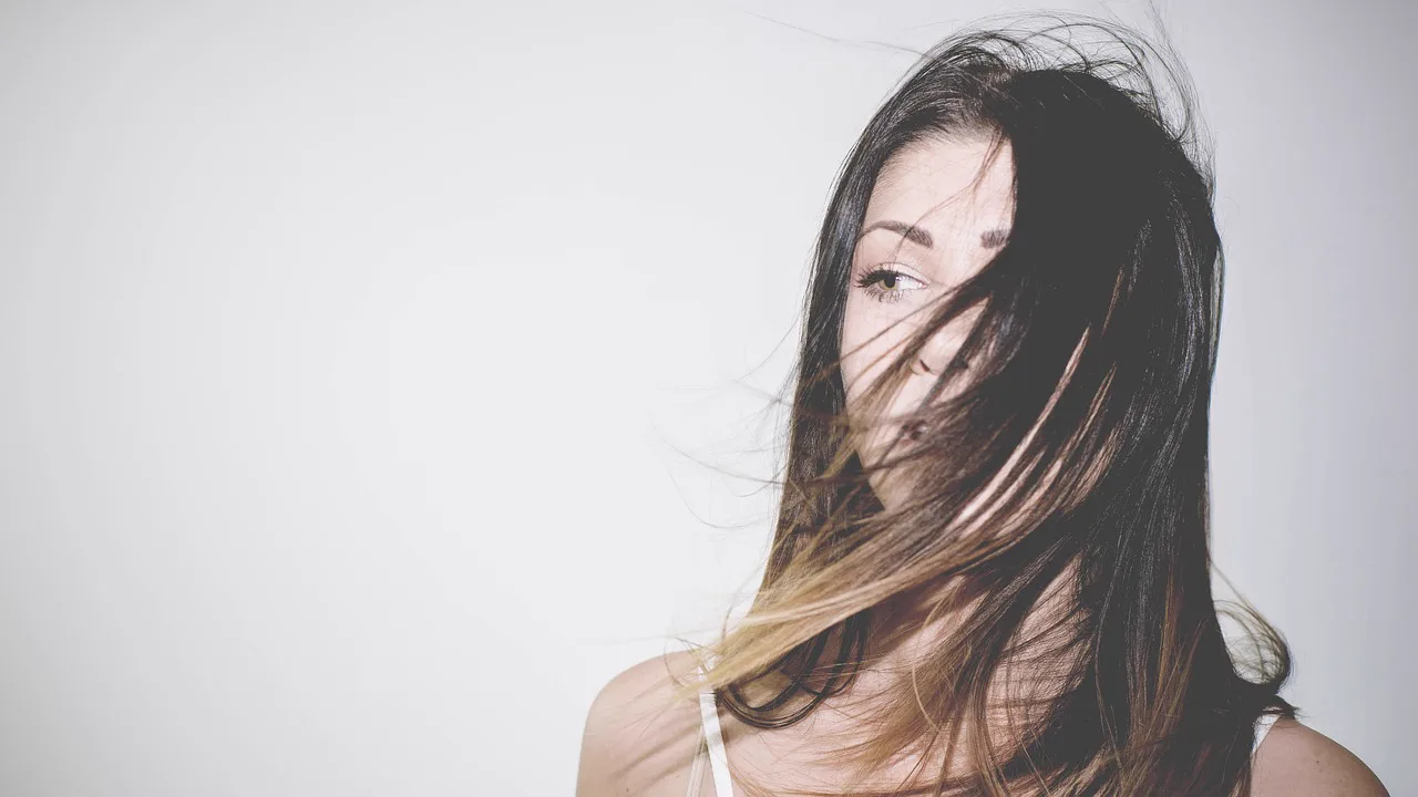 Woman with long, healthy hair in motion